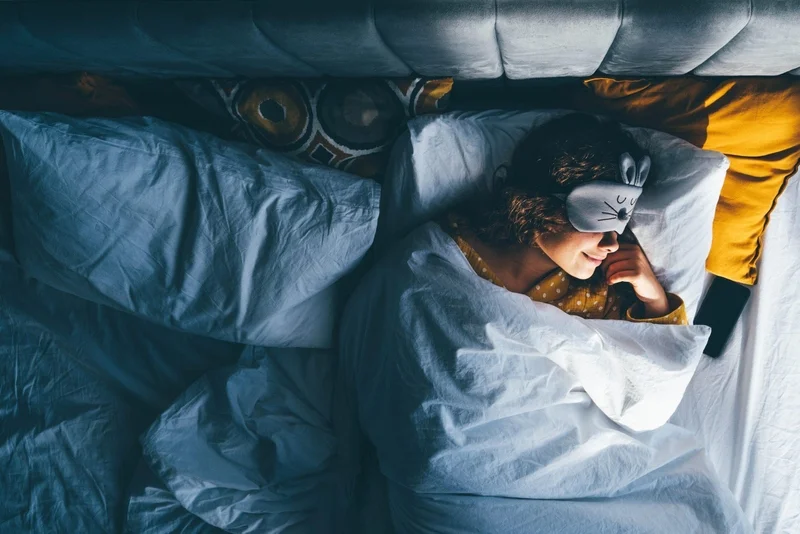 East Coast Telepsychiatry - 10 Great Ways to Improve Your Mental Health. Woman peacefully sleeping at night.